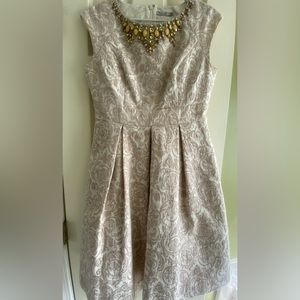 Eliza J Beige/ Gold Cocktail Dress. Knee Length with Beading Around Neck Line.